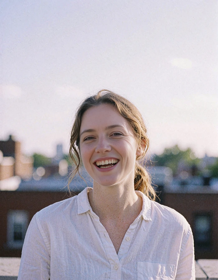 Cheerful light-brown-haired woman in a white shirt on a South Loop terrace in late morning - demonstration profile photo